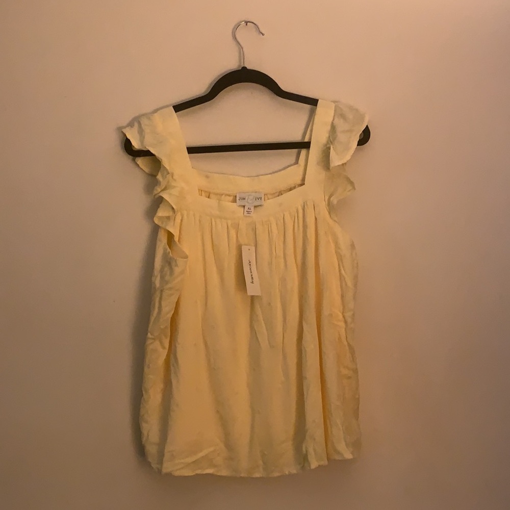 A pale yellow shirt purchased from Francescas. NWT